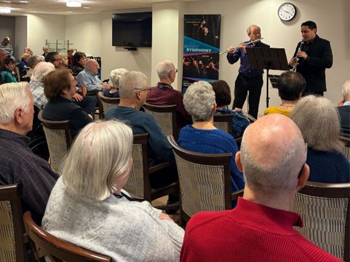 Bart Feller and Juan Esteban Martinez performing for seniors at the Lantern Hill Senior Living Community